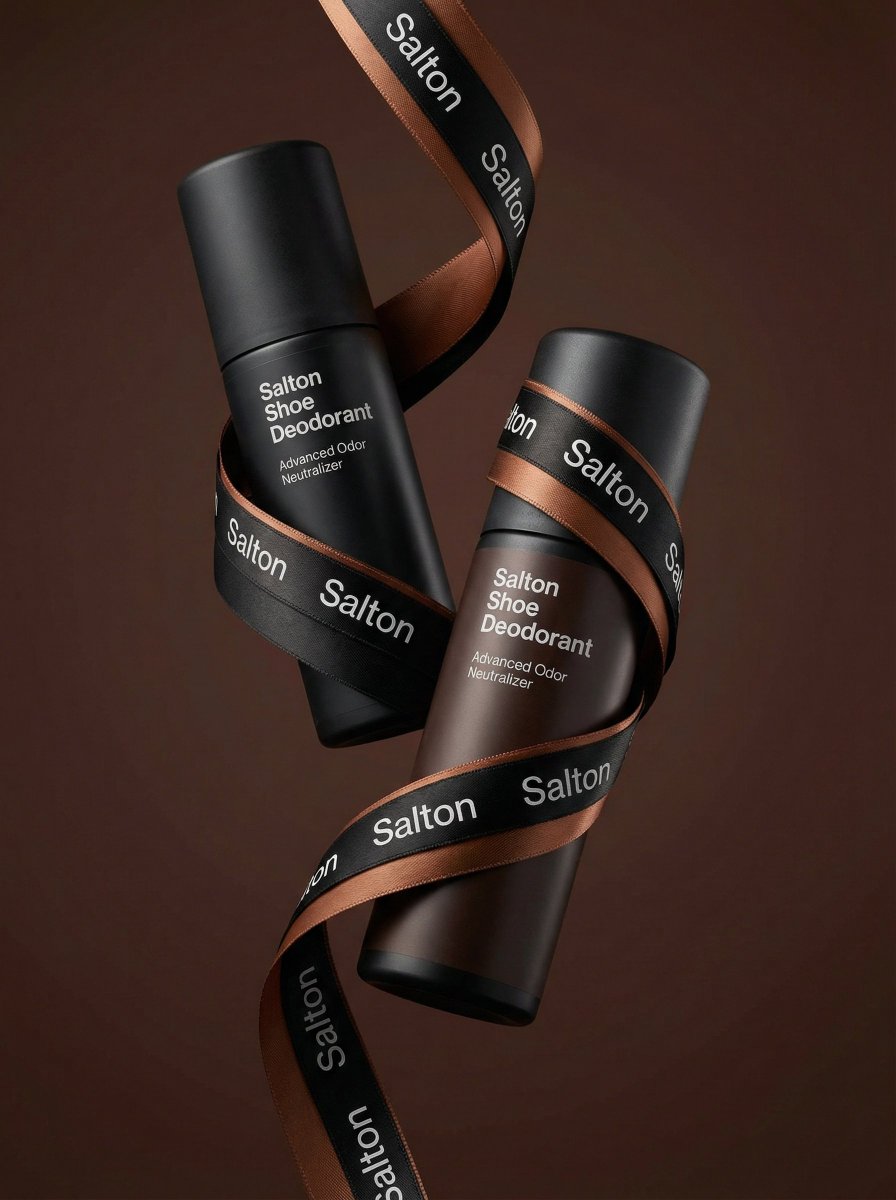 A product photo in a premium advertising style. Two tall matte bottles of Salton Shoe Deodorant lev…