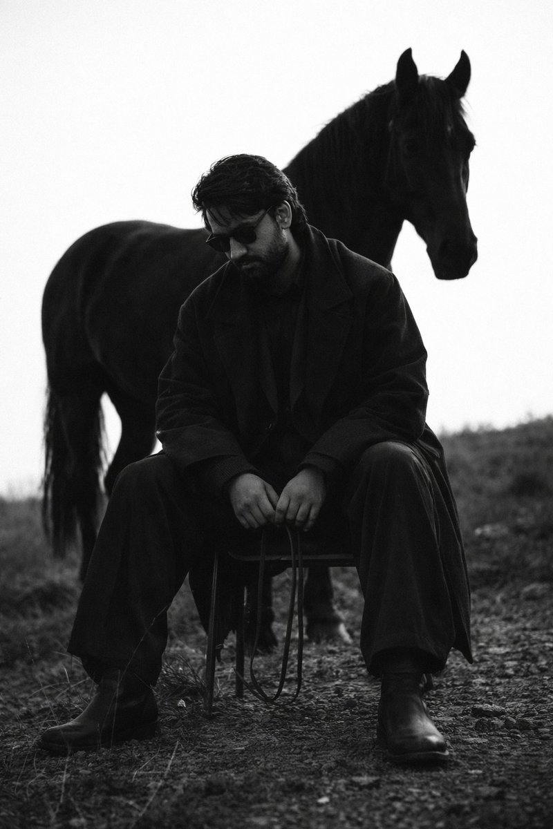 Cinematic Black and White Man and Horse Portrait