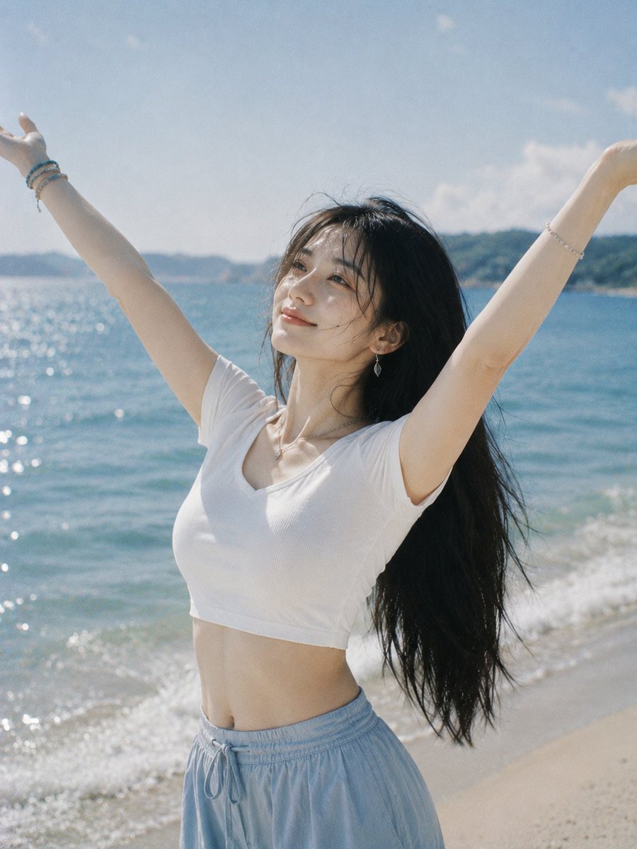 Joyful Woman Raising Arms at Beach