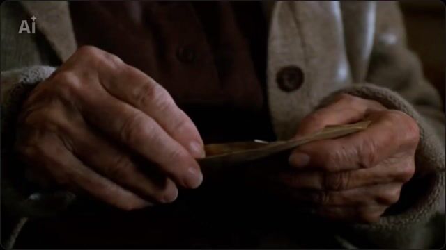 Elderly woman opening envelope video prompt
