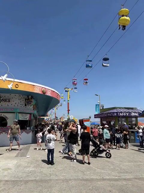 Giant cartoon girl vlog at an amusement park